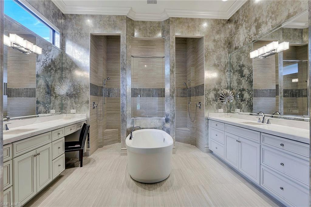 16434 Seneca Way Naples, FL 34110 - Photo 17 of 35 a bathroom with a granite countertop sink toilet and shower