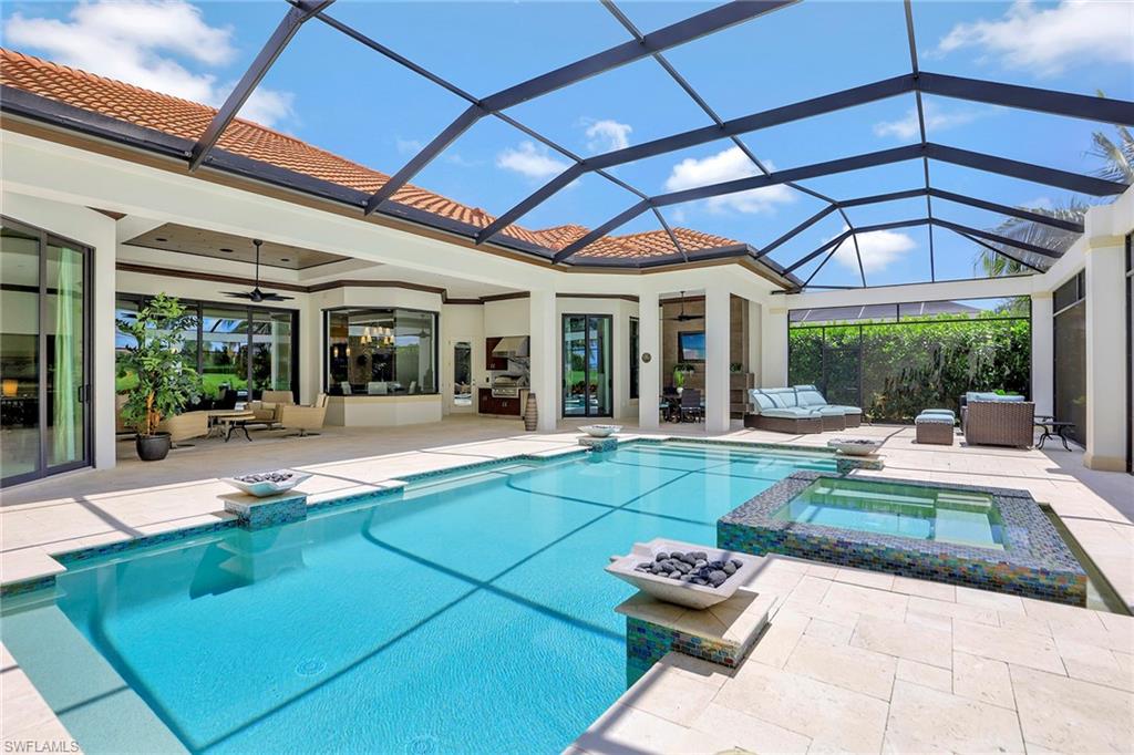16434 Seneca Way Naples, FL 34110 - Photo 25 of 35 a swimming pool with outdoor seating and yard