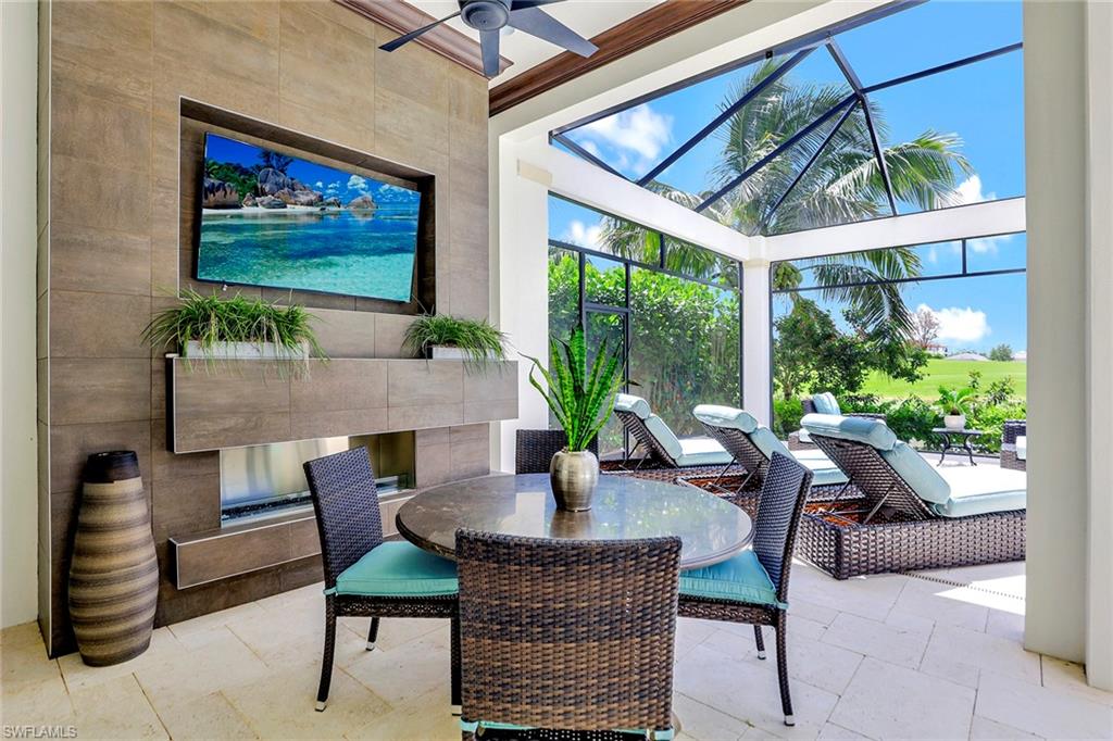 16434 Seneca Way Naples, FL 34110 - Photo 29 of 35 a outdoor dining space with furniture and outdoor view