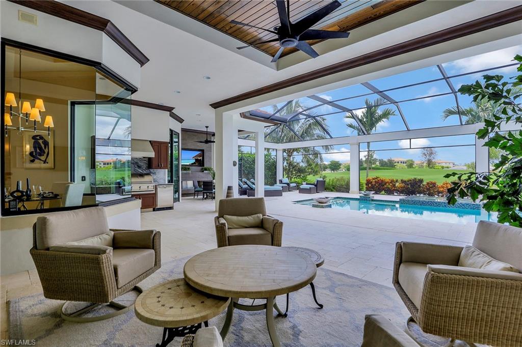 16434 Seneca Way Naples, FL 34110 - Photo 31 of 35 a living room with furniture and a large window