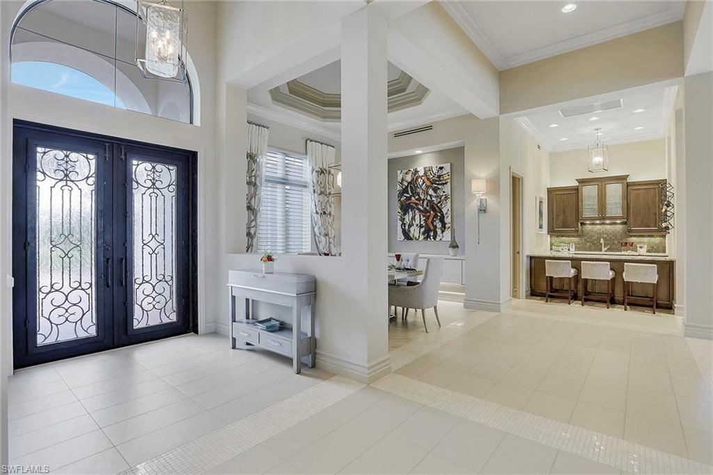 16434 Seneca Way Naples, FL 34110 - Photo 33 of 35 a living room with furniture and a large window