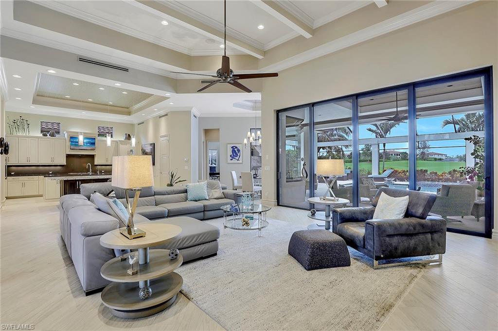 16434 Seneca Way Naples, FL 34110 - Photo 4 of 35 a living room with furniture and a large window