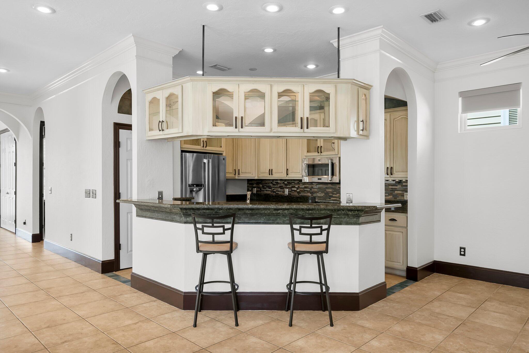 3929 Indian Springs Road Panama City, FL 32404 - Photo 14 of 51 Barstools area at the kitchen.