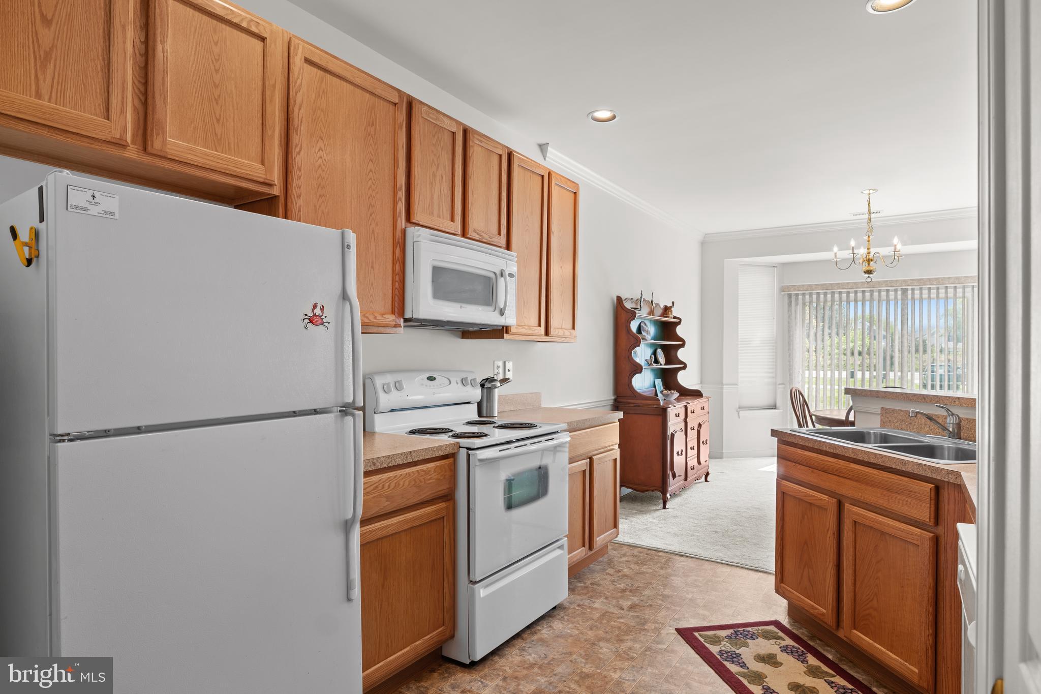 5 St George Ocean View, DE 19970 - Photo 11 of 29 a kitchen with a refrigerator stove and sink
