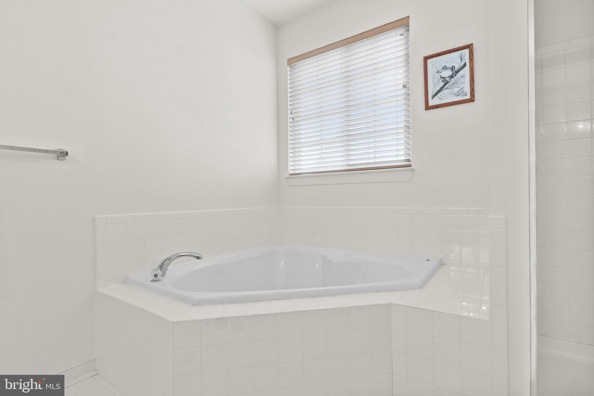 5 St George Ocean View, DE 19970 - Photo 21 of 29 a white bath tub sitting next to a window