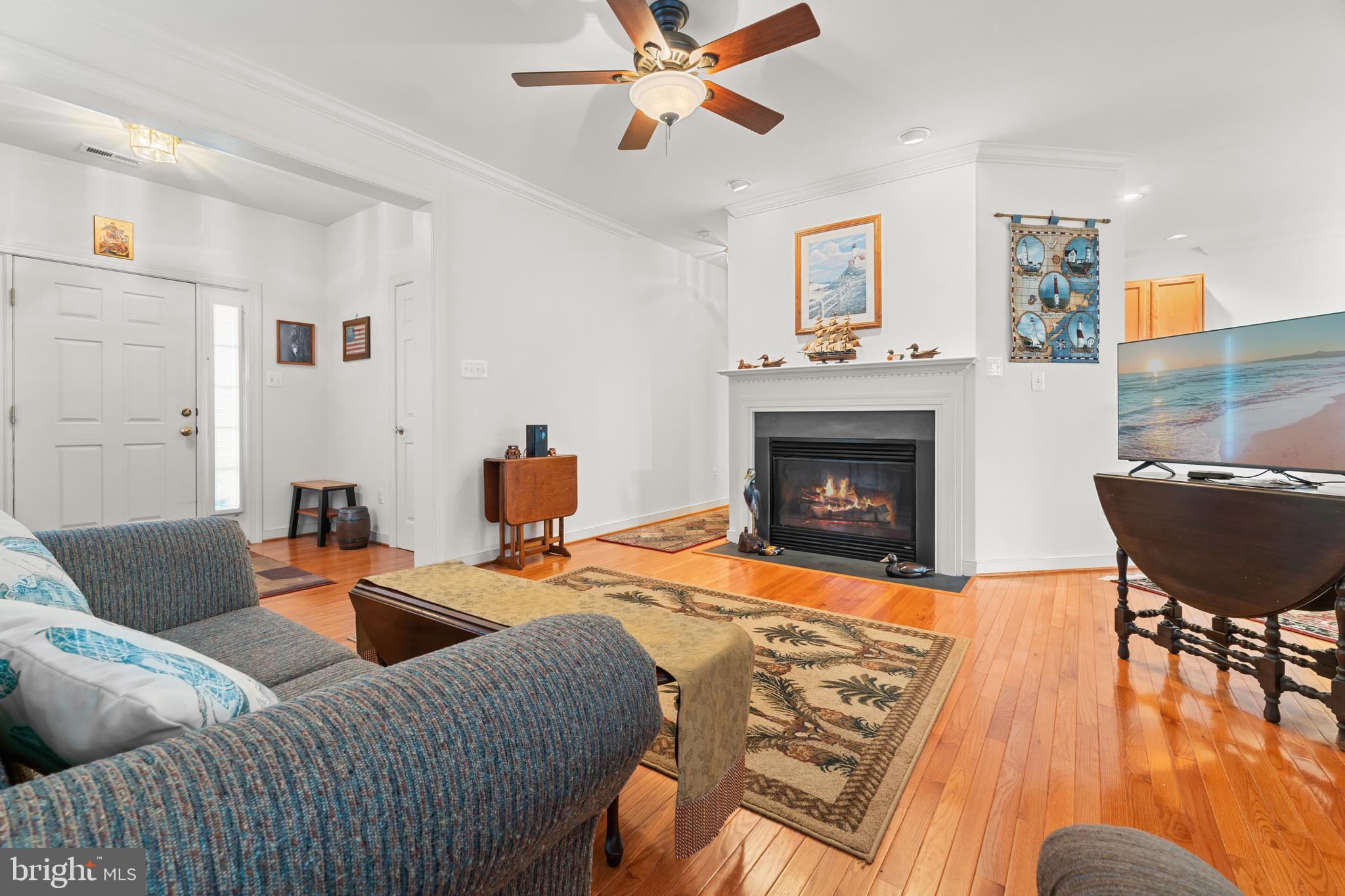 5 St George Ocean View, DE 19970 - Photo 6 of 29 a living room with furniture and a fireplace