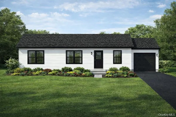 a front view of house with a garden