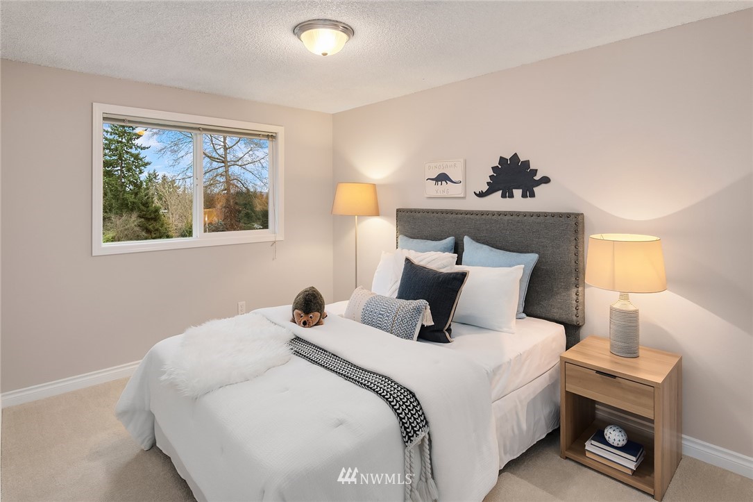 20102 103rd Place Northeast Bothell, WA 98011 - Photo 13 of 22 a bedroom with a bed and a window