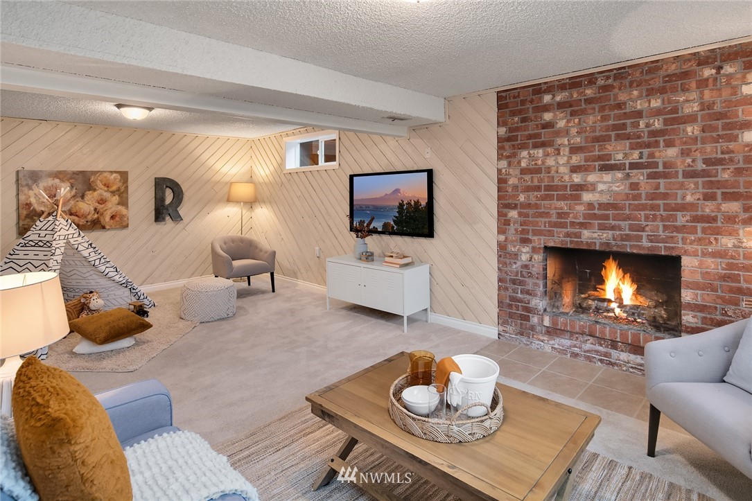 20102 103rd Place Northeast Bothell, WA 98011 - Photo 17 of 22 a living room with furniture and a fireplace
