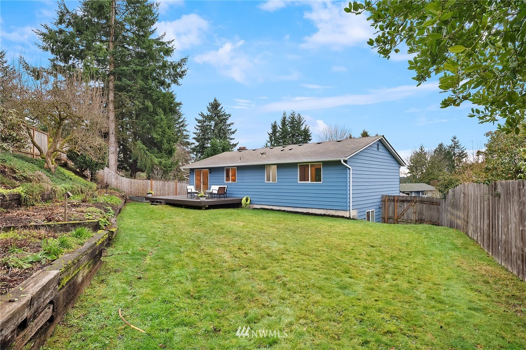 20102 103rd Place Northeast Bothell, WA 98011 - Photo 19 of 22 a view of a house with backyard and sitting area
