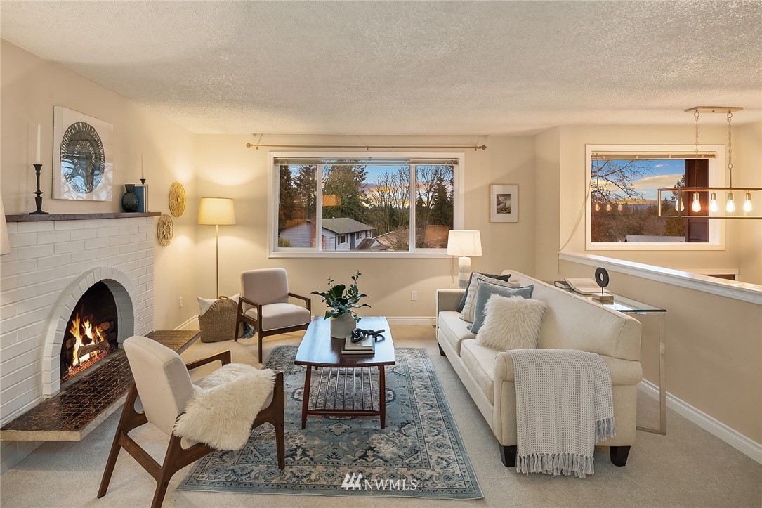 20102 103rd Place Northeast Bothell, WA 98011 - Photo 2 of 22 a living room with furniture and a fireplace