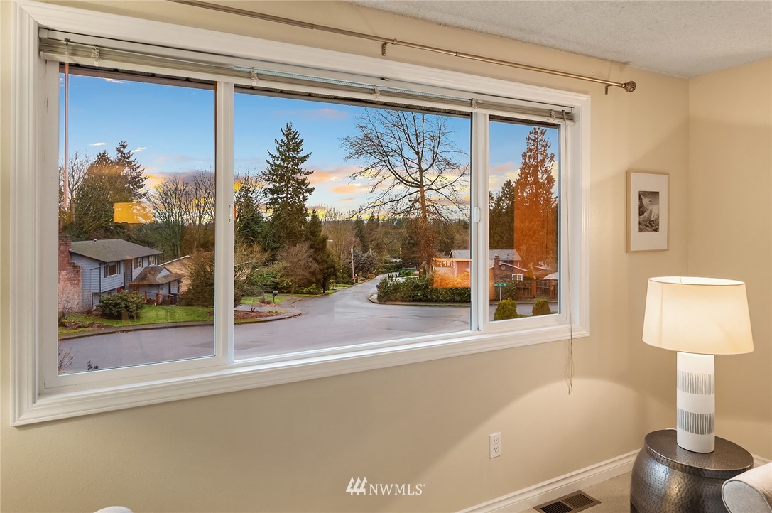 20102 103rd Place Northeast Bothell, WA 98011 - Photo 3 of 22 a front view of a house with a yard and garage