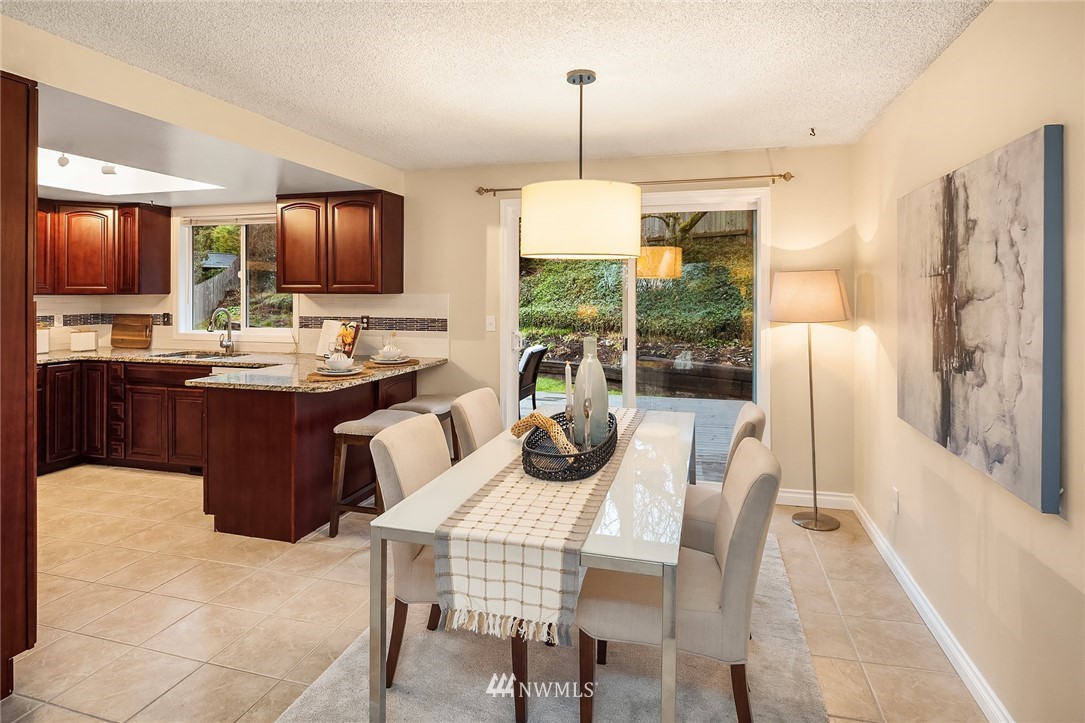 20102 103rd Place Northeast Bothell, WA 98011 - Photo 6 of 22 a dining room with furniture a chandelier and window