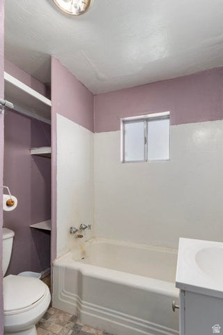 482 West 100 N Street Beaver, UT 84713 - Photo 15 of 41 Full bath with vanity, stone finish flooring, and bathing tub / shower combination