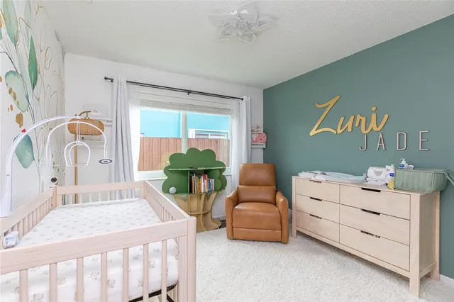 a bedroom with furniture and a window