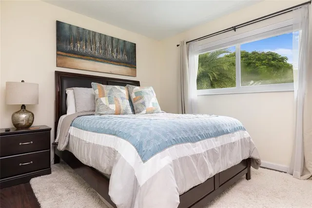 a bedroom with a bed and window