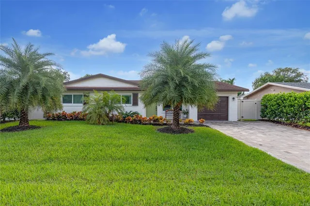 a front view of house with yard and outdoor seating