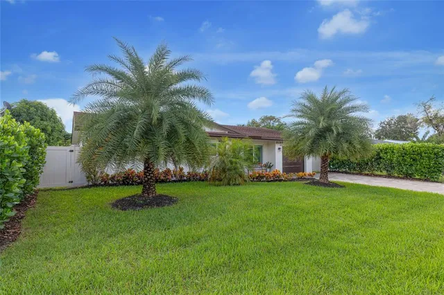 a view of a trees and front view of a house