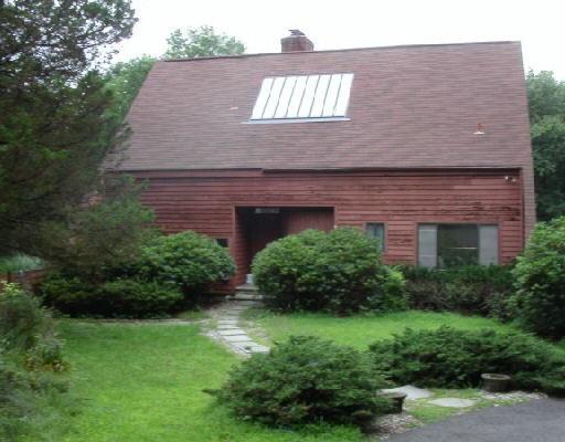 62 Hillbrook Road Wilton, CT 06897 - Photo 1 of 1 a front view of a house with a yard