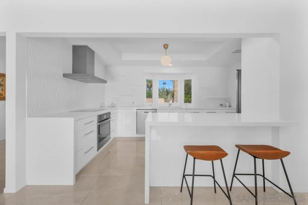 1606 Yaqui Road Borrego Springs, CA 92004 - Photo 15 of 51 a kitchen with stainless steel appliances a stove a sink refrigerator and a chair