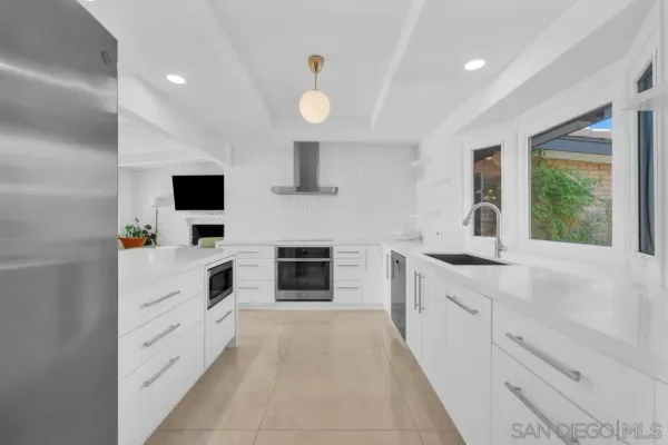 a kitchen with a stove and a sink