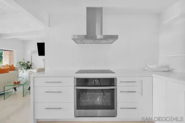 a kitchen with a sink cabinets and window