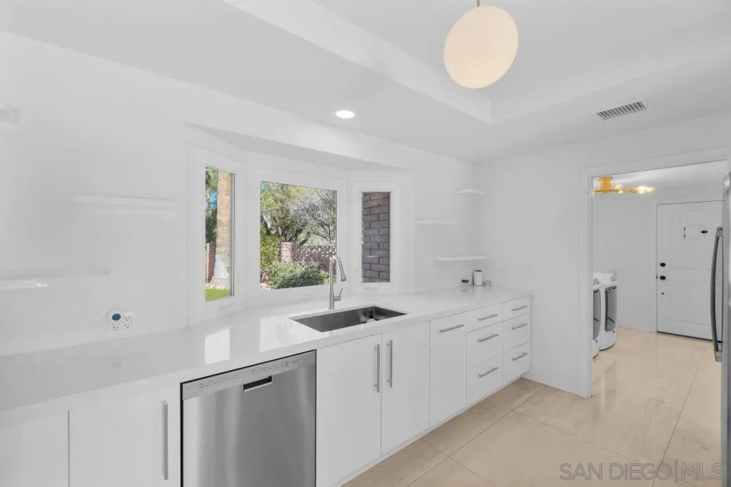 1606 Yaqui Road Borrego Springs, CA 92004 - Photo 19 of 51 a kitchen with a sink cabinets and window