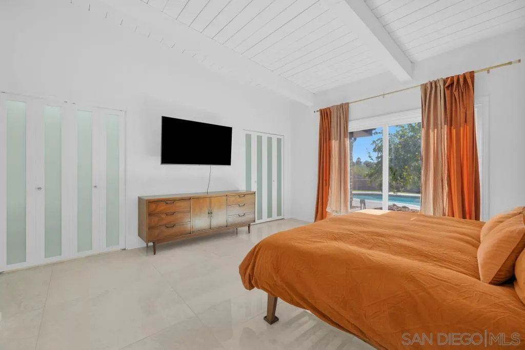 1606 Yaqui Road Borrego Springs, CA 92004 - Photo 21 of 51 a bedroom with a bed and a flat screen tv