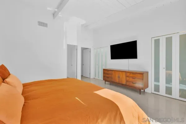 a bathroom with a shower and a glass door