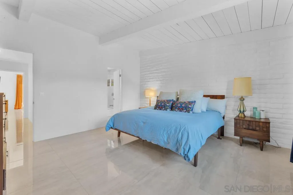 1606 Yaqui Road Borrego Springs, CA 92004 - Photo 25 of 51 a bedroom with a bed and a lamp on table
