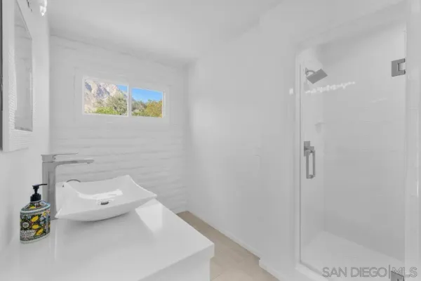 a kitchen with a sink a stove and a microwave