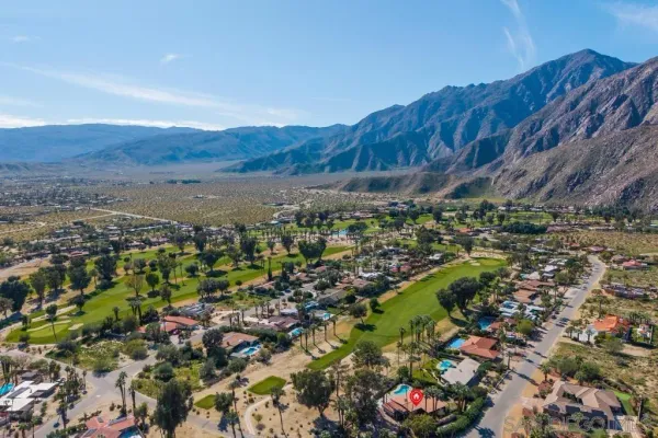 a view of a city with mountains in the background