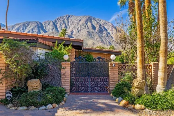 a house with garden in front of it