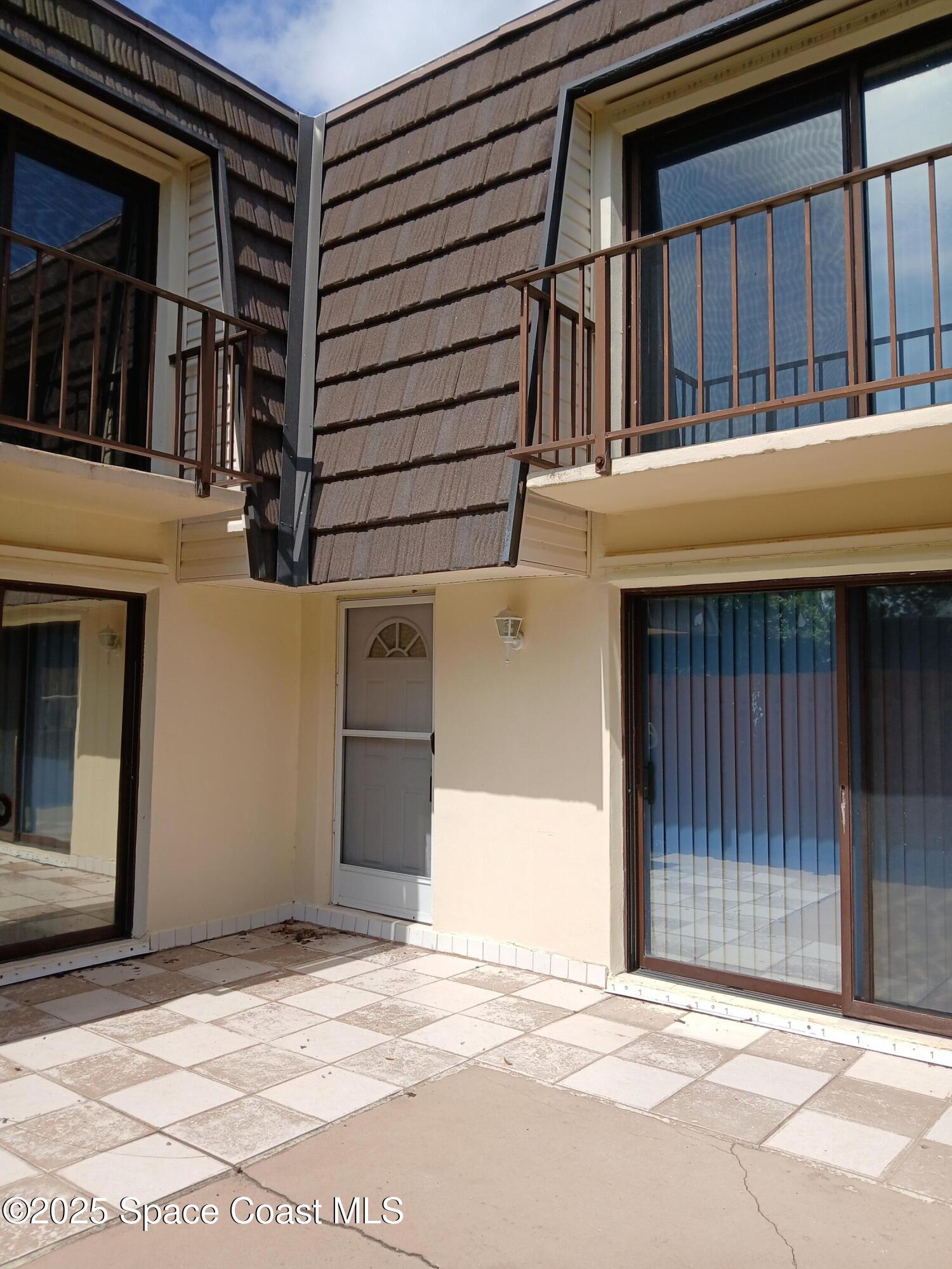 3218 Vista Oaks Circle Northeast Palm Bay, FL 32905 - Photo 2 of 11 a view of a door of the house