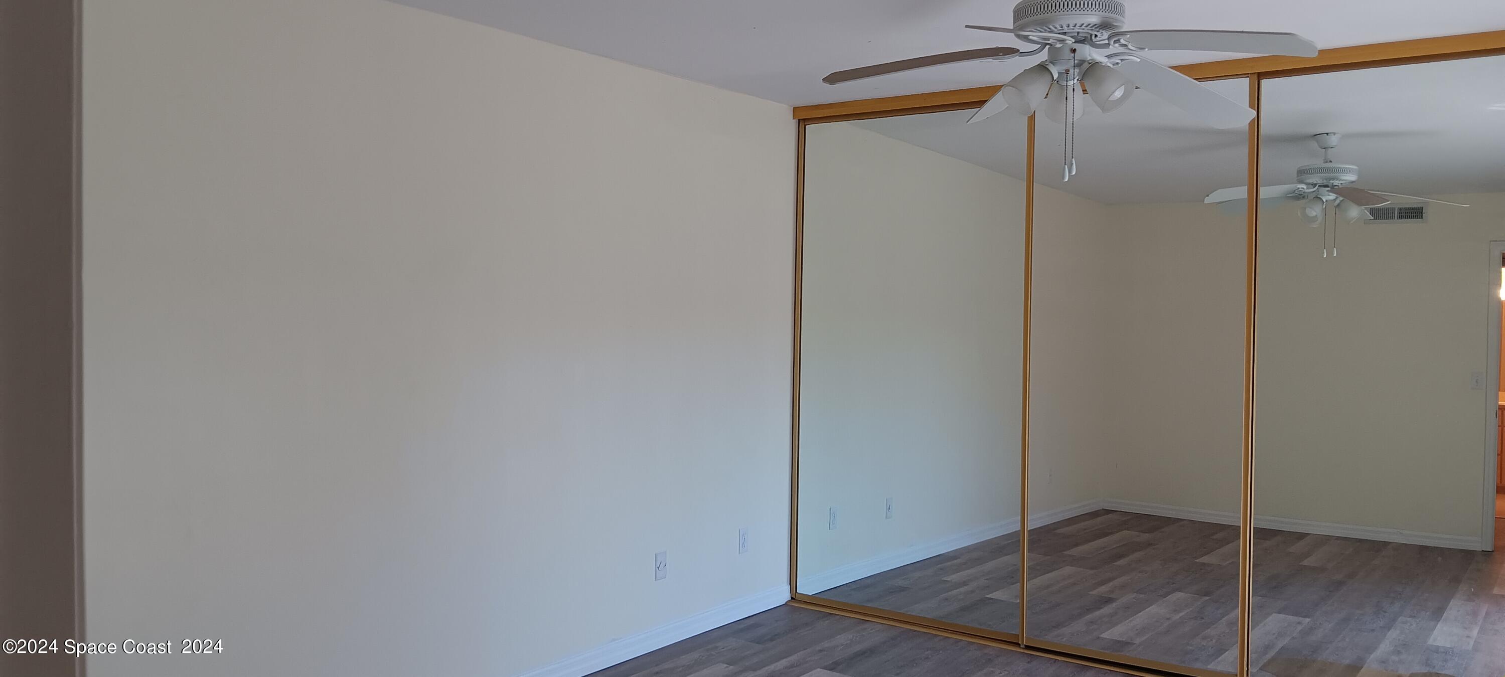 3218 Vista Oaks Circle Northeast Palm Bay, FL 32905 - Photo 7 of 11 a view of room with hardwood floor