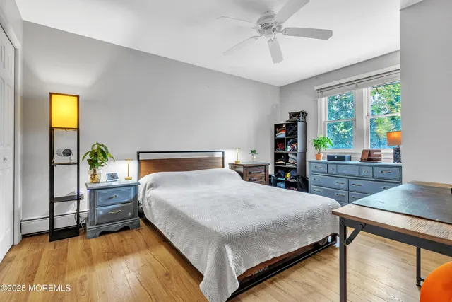 a bedroom with a bed and a table in it