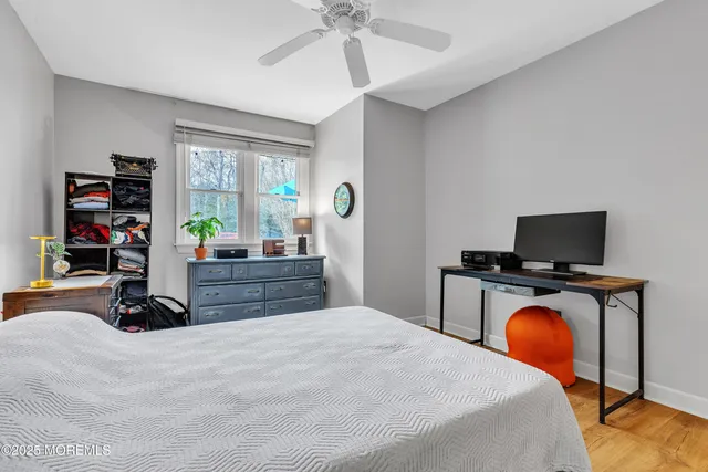 a bedroom with bed and tv