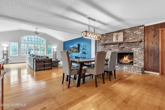 a view of a livingroom with furniture window and wooden floor