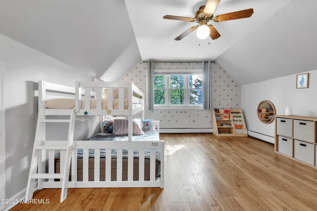 a bedroom with furniture and a window
