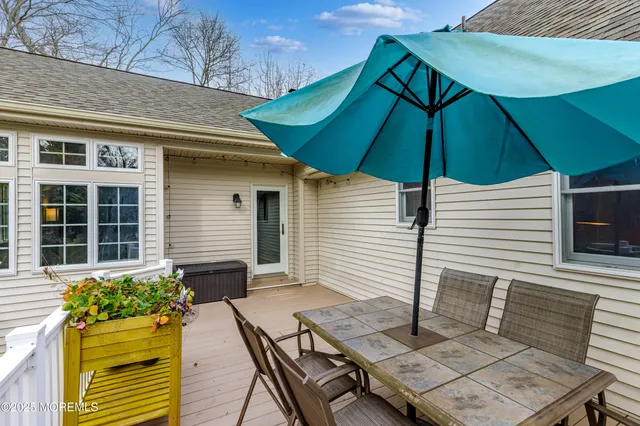 an outdoor space with furniture and umbrella