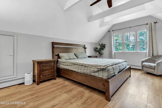 a bedroom with a bed and a couch