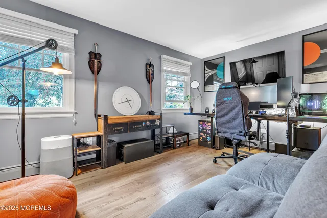 a living room filled with furniture and a flat screen tv