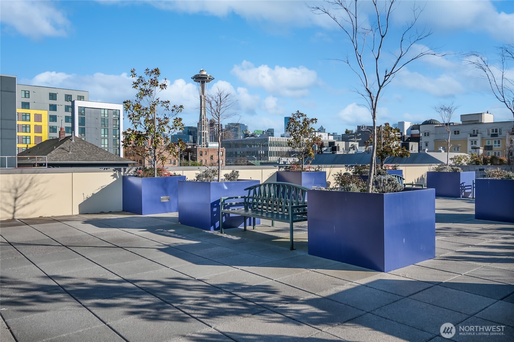 17 West Mercer Street, Unit 217 Seattle, WA 98119 - Photo 1 of 36 a view of a terrace with a bench