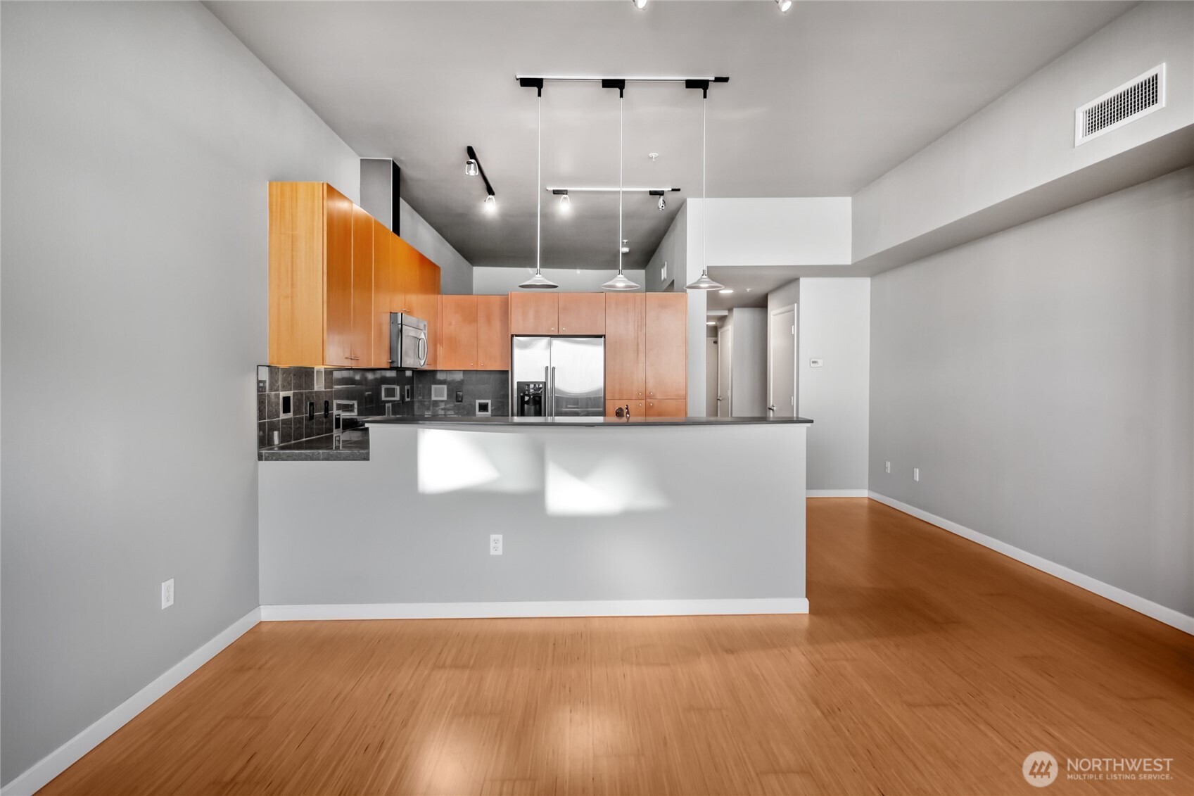 17 West Mercer Street, Unit 217 Seattle, WA 98119 - Photo 11 of 36 a view of a kitchen with a sink and wooden floor