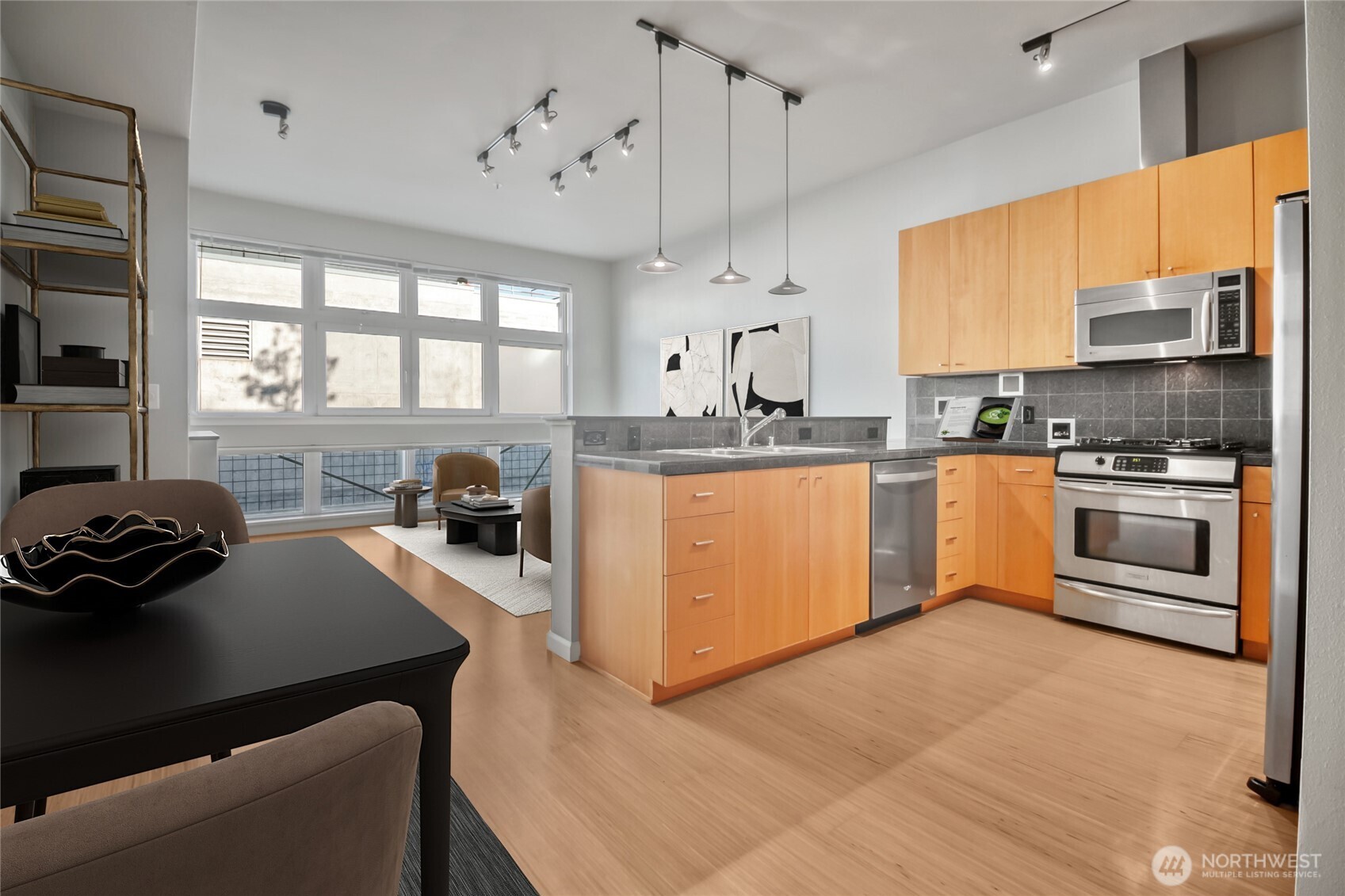17 West Mercer Street, Unit 217 Seattle, WA 98119 - Photo 14 of 36 a kitchen with a stove a sink and a refrigerator