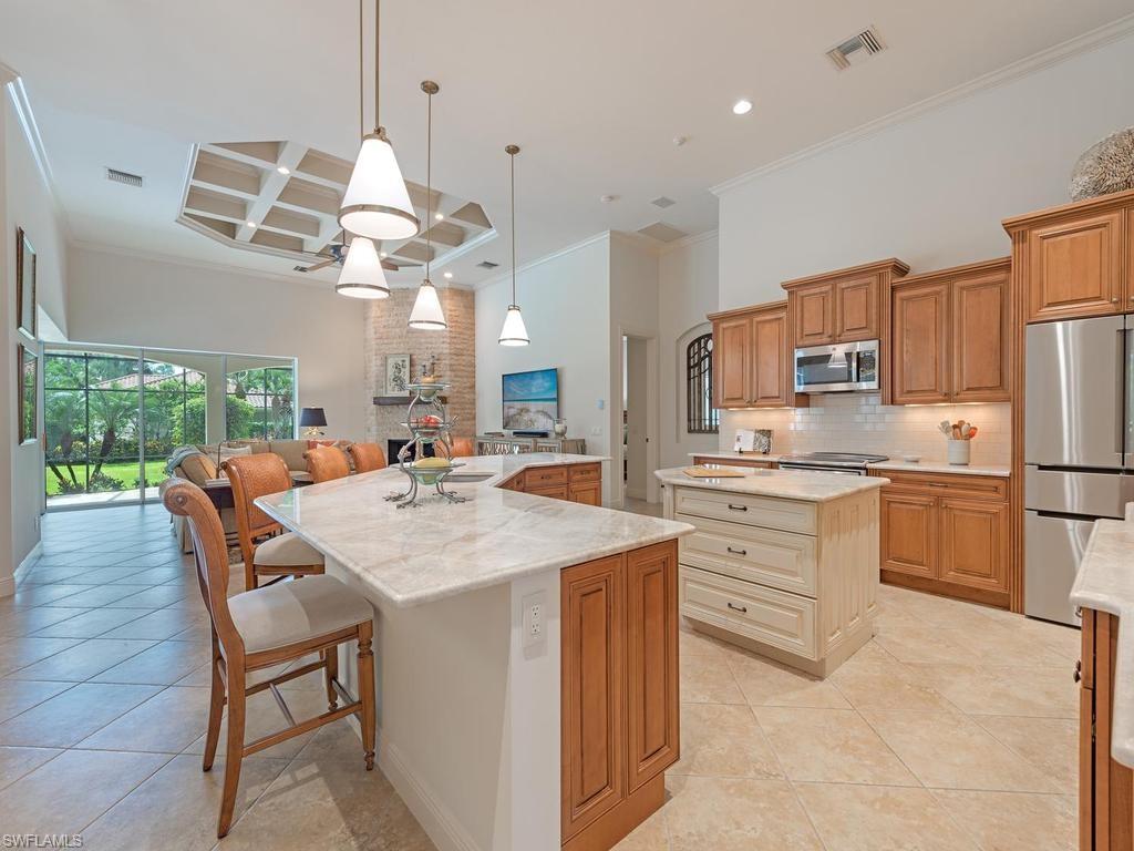 5140 Tamarind Ridge Drive Naples, FL 34119 - Photo 10 of 25 Master Suite with sitting room and two (2) walk-in closets. View to the 2 Pools and spa.