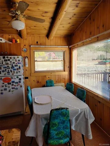 a view of a room with racks a kitchen
