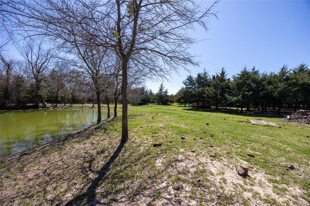 645 County Road 4160 Bonham, TX 75418 - Photo 7 of 37 View of yard featuring a water view