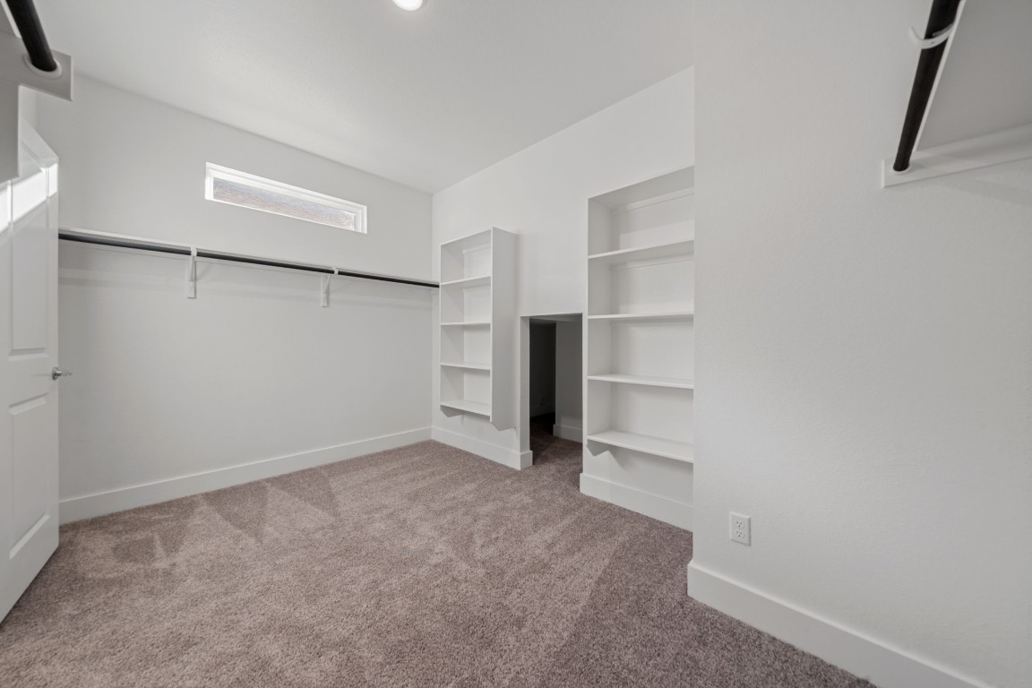 217 Pinnacle Lane Kyle, TX 78640 - Photo 19 of 33 a view of an empty walk in closet