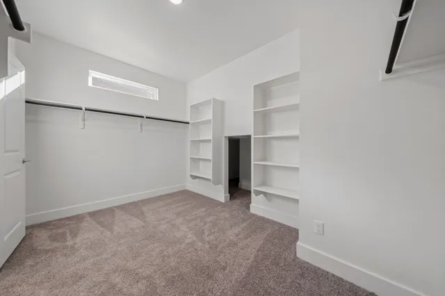 a view of an empty walk in closet